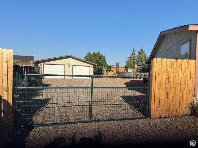 990 S Freedom Way, Big Water, UT 84741 - view of gate with an outdoor structure