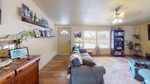 990 S Freedom Way, Big Water, UT 84741 - living room featuring ceiling fan, a textured ceiling, and dark hardwood / wood-style flooring