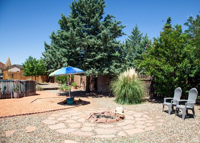 990 S Freedom Way, Big Water, UT 84741 - view of patio / terrace with an outdoor fire pit