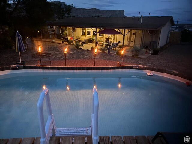 990 S Freedom Way, Big Water, UT 84741 - pool at dusk featuring a patio