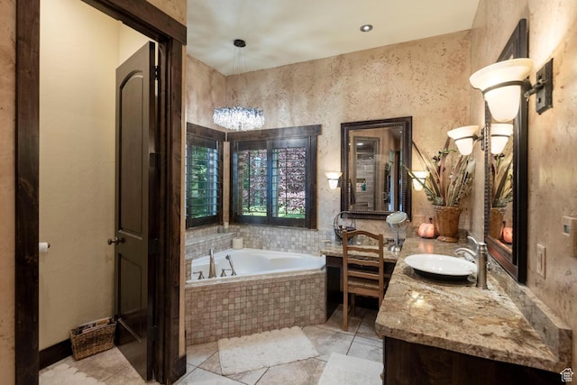 bathroom featuring vanity and a bath