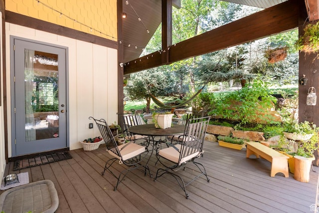 wooden deck featuring outdoor dining space