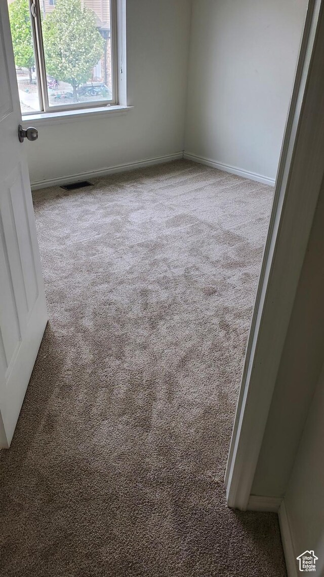 1596 W 300 S Unit 14, Vernal, UT 84078 - unfurnished room with visible vents, carpet flooring, and baseboards