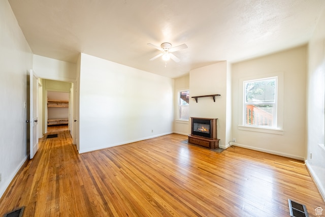 89 W 100 S, Kanab, UT 84741 - unfurnished living room featuring ceiling fan and light hardwood / wood-style flooring