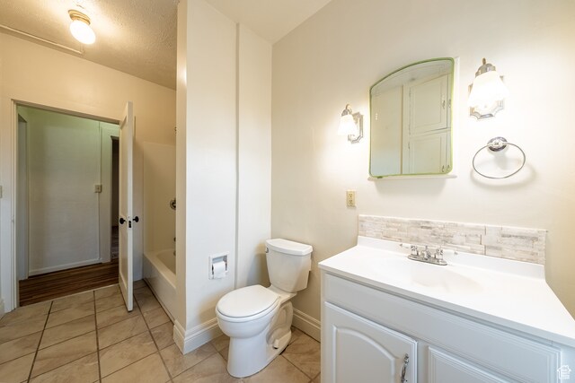 89 W 100 S, Kanab, UT 84741 - full bathroom featuring vanity, tile patterned floors, bathtub / shower combination, and toilet
