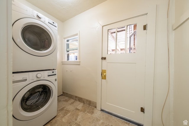 89 W 100 S, Kanab, UT 84741 - laundry room featuring light tile patterned flooring and stacked washer and dryer