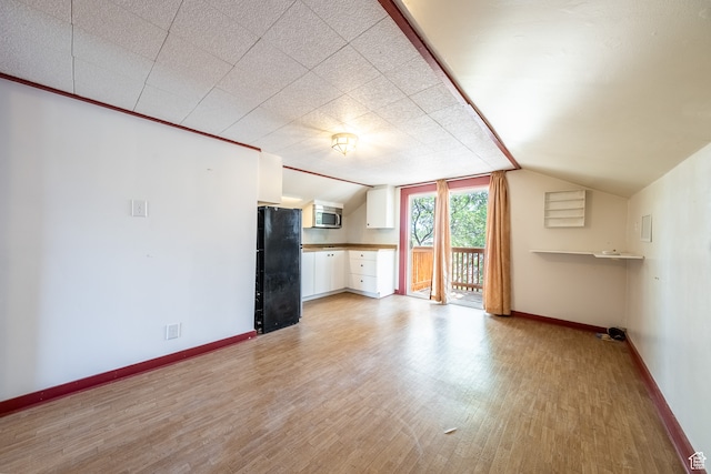 89 W 100 S, Kanab, UT 84741 - additional living space with vaulted ceiling and light hardwood / wood-style floors
