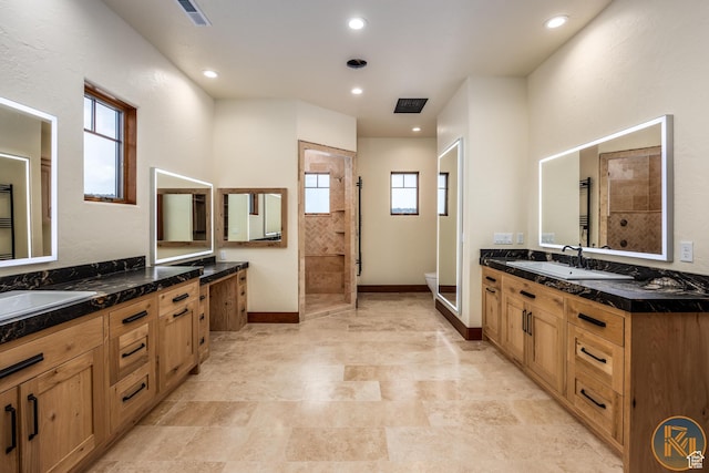5605 N Johnson Canyon Rd, Kanab, UT 84741 - full bath with healthy amount of natural light, walk in shower, two vanities, toilet, and recessed lighting