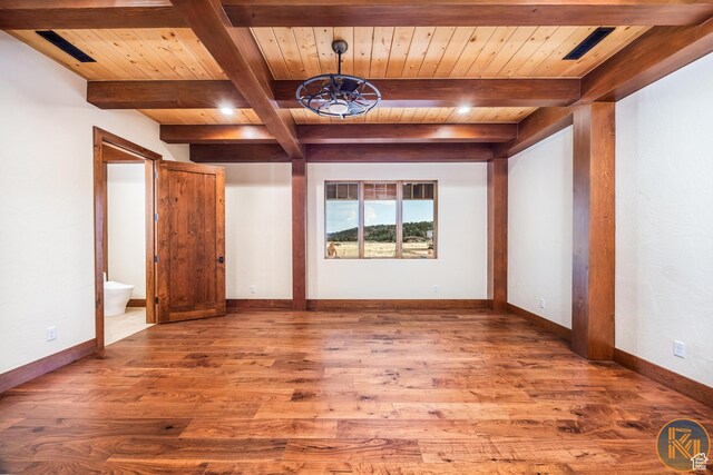 5605 N Johnson Canyon Rd, Kanab, UT 84741 - unfurnished room with wood ceiling with exposed beams, wood finished floors, a chandelier, and baseboards
