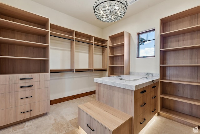 5605 N Johnson Canyon Rd, Kanab, UT 84741 - walk in closet featuring a chandelier
