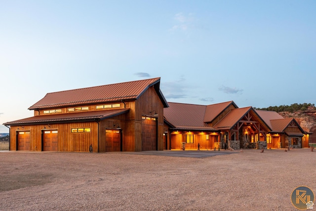 5605 N Johnson Canyon Rd, Kanab, UT 84741 - view of front of house with metal roof, driveway, and a standing seam roof