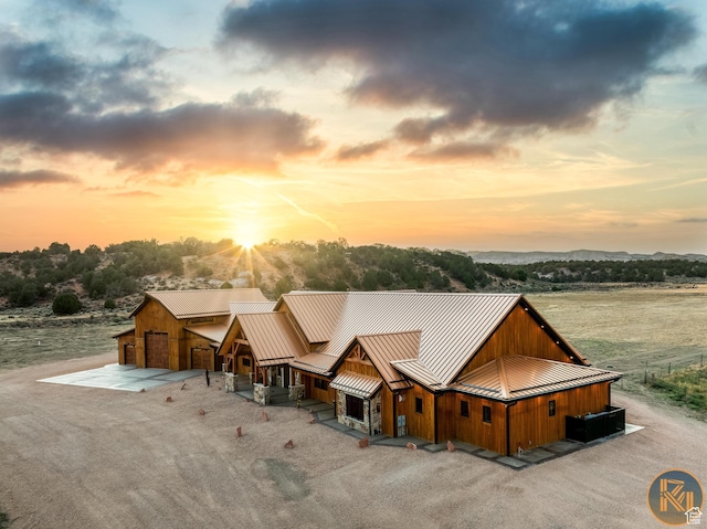 5605 N Johnson Canyon Rd, Kanab, UT 84741 - view of front of property featuring a standing seam roof, metal roof, driveway, and board and batten siding