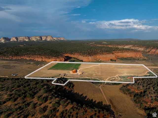 5605 N Johnson Canyon Rd, Kanab, UT 84741 - aerial view of sparsely populated area featuring property parcel outlined and mountains