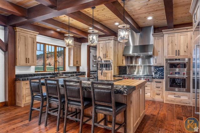 5605 N Johnson Canyon Rd, Kanab, UT 84741 - kitchen featuring wooden ceiling with exposed beams, double oven, a kitchen island with sink, dark wood-style flooring, and a sink