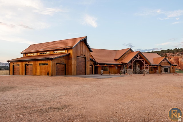 5605 N Johnson Canyon Rd, Kanab, UT 84741 - view of front facade with dirt driveway, metal roof, and a detached garage