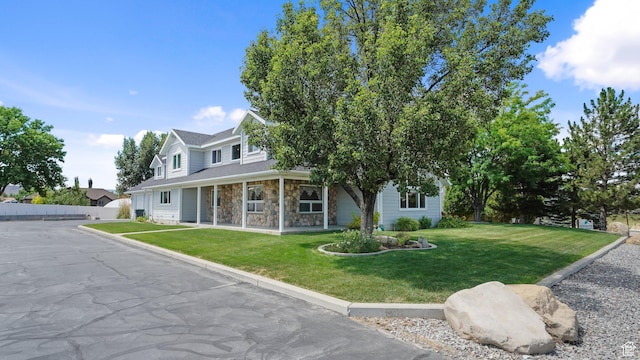 401 N Fairgrounds Rd, Price, UT 84501 - view of front of house with covered porch and a front lawn