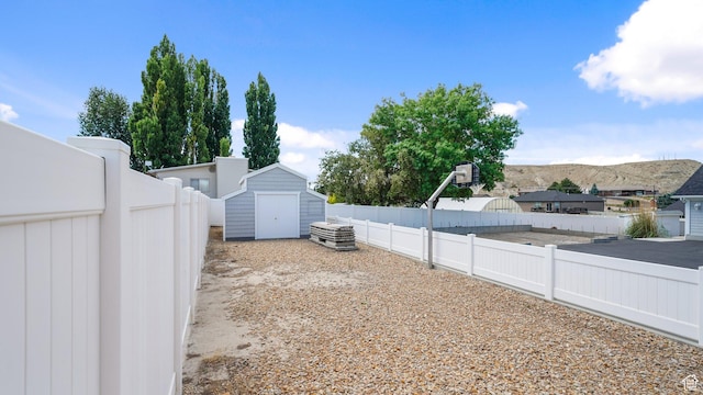 401 N Fairgrounds Rd, Price, UT 84501 - view of yard with a mountain view and a storage shed