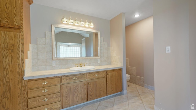 401 N Fairgrounds Rd, Price, UT 84501 - bathroom with tile patterned flooring, toilet, vanity, and decorative backsplash