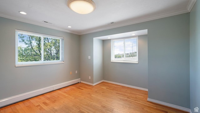 401 N Fairgrounds Rd, Price, UT 84501 - spare room featuring crown molding, a baseboard radiator, and light hardwood / wood-style flooring