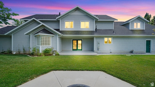 401 N Fairgrounds Rd, Price, UT 84501 - back house at dusk with a patio and a lawn