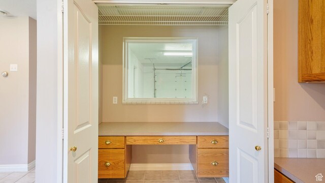 401 N Fairgrounds Rd, Price, UT 84501 - interior space featuring light tile patterned floors and built in desk