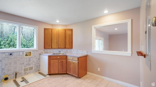 401 N Fairgrounds Rd, Price, UT 84501 - kitchen featuring sink, a wealth of natural light, and light tile patterned floors