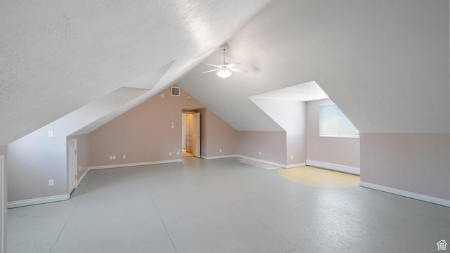 401 N Fairgrounds Rd, Price, UT 84501 - bonus room featuring vaulted ceiling, ceiling fan, and a textured ceiling