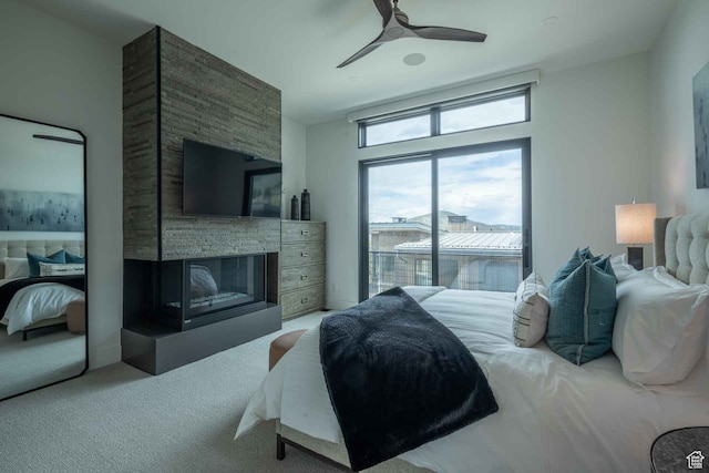 3599 Ridgeline Dr Unit 2, Park City, UT 84098 - carpeted bedroom featuring access to exterior, ceiling fan, and a multi sided fireplace