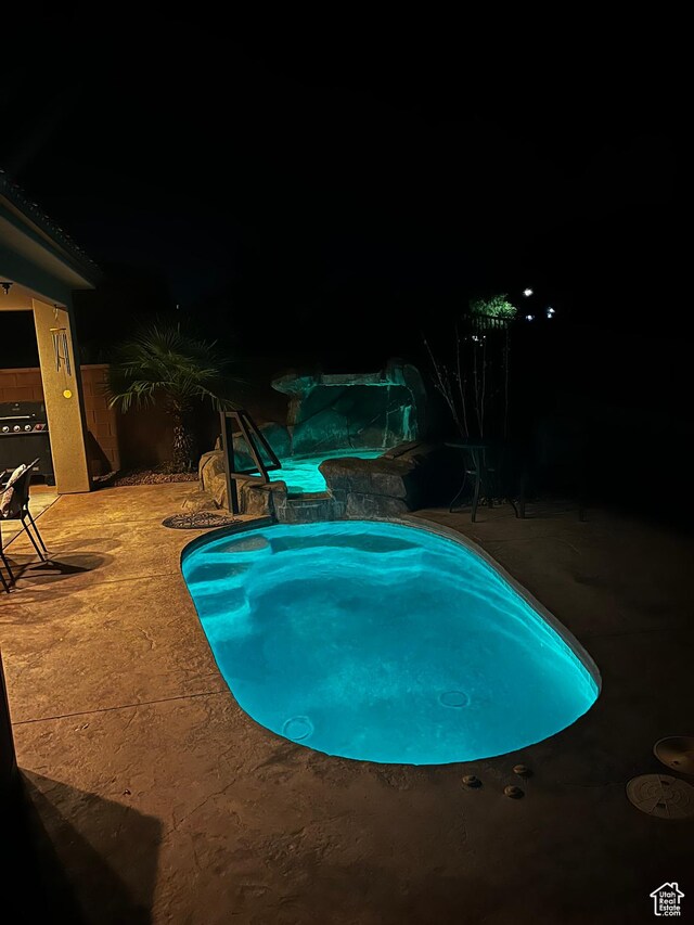 650 N Red Stone Rd Unit 22, Washington, UT 84780 - pool at twilight featuring a patio and a jacuzzi