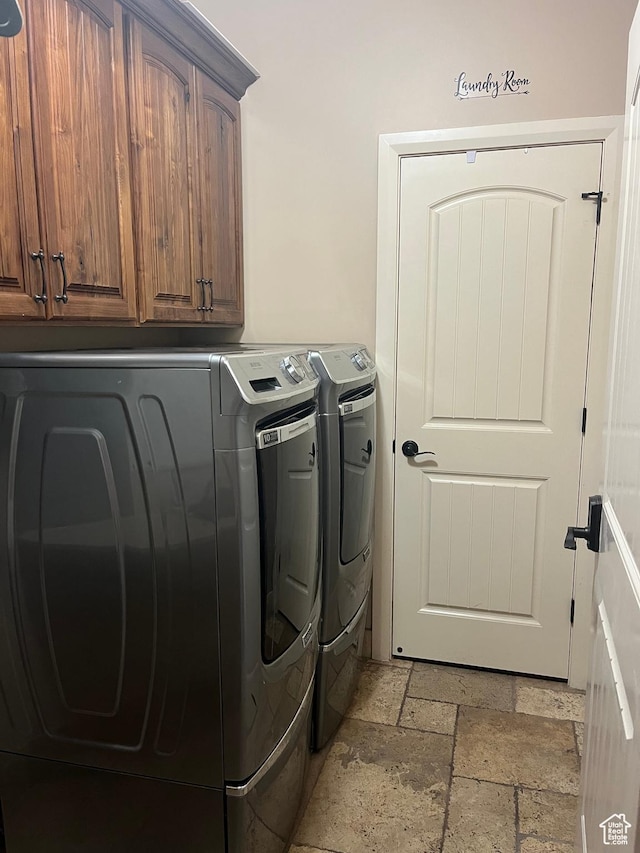 650 N Red Stone Rd Unit 22, Washington, UT 84780 - laundry area with washing machine and clothes dryer, cabinet space, and stone tile flooring