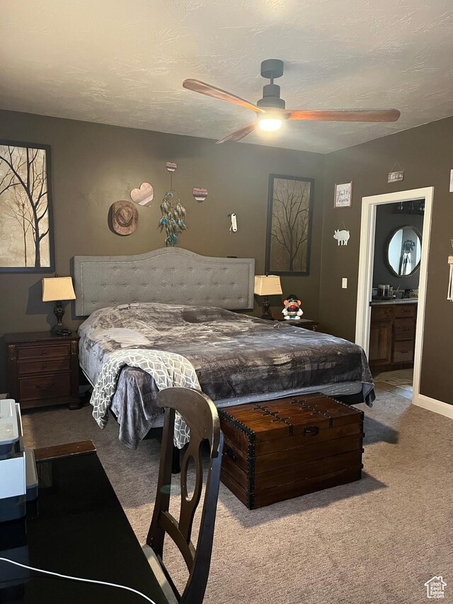 650 N Red Stone Rd Unit 22, Washington, UT 84780 - carpeted bedroom featuring ensuite bath and ceiling fan