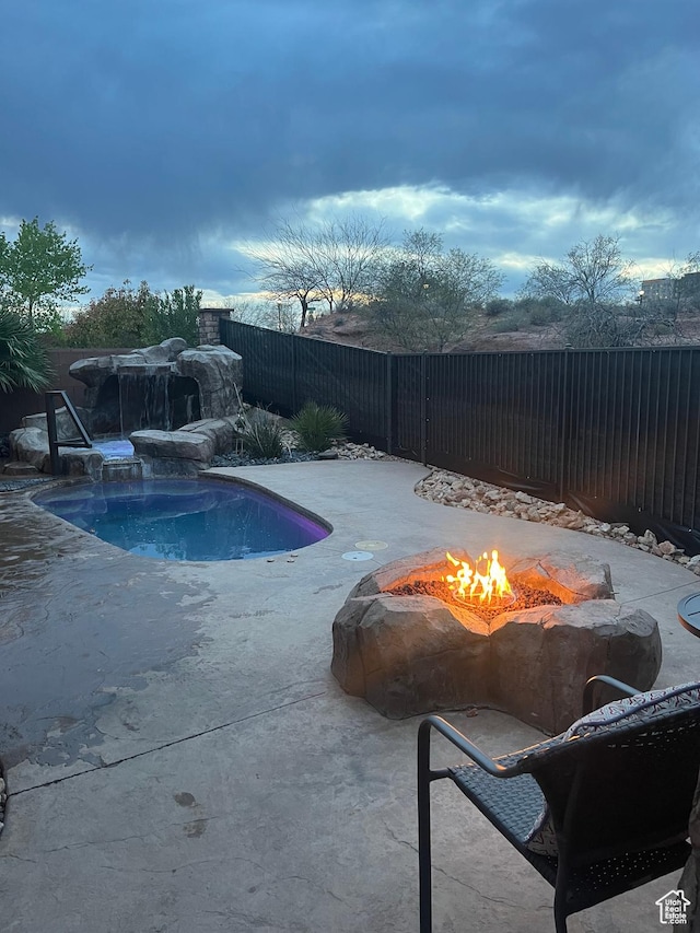 650 N Red Stone Rd Unit 22, Washington, UT 84780 - view of pool featuring a fire pit, a patio area, a fenced backyard, and a fenced in pool