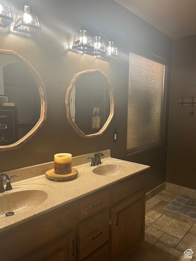650 N Red Stone Rd Unit 22, Washington, UT 84780 - bathroom featuring a sink, stone tile floors, and double vanity