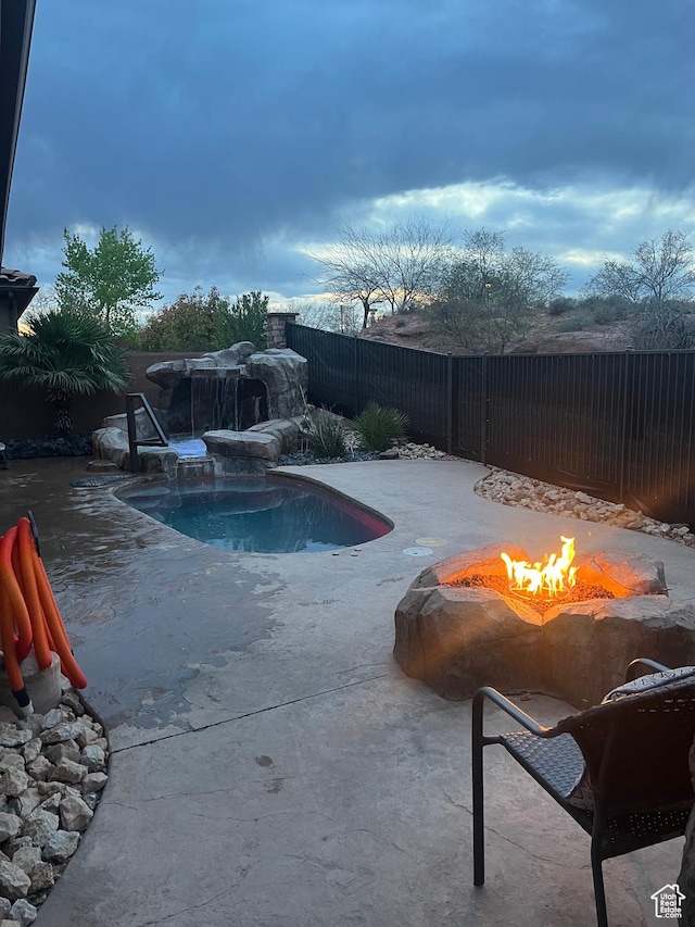 650 N Red Stone Rd Unit 22, Washington, UT 84780 - view of pool with an outdoor fire pit, a patio, a fenced backyard, and a fenced in pool