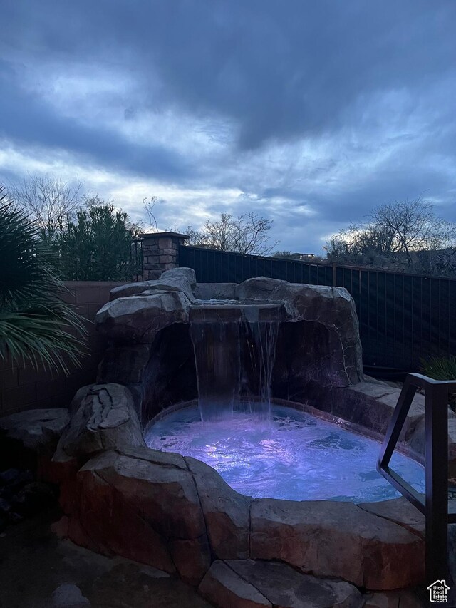 650 N Red Stone Rd Unit 22, Washington, UT 84780 - exterior space featuring a jacuzzi and fence
