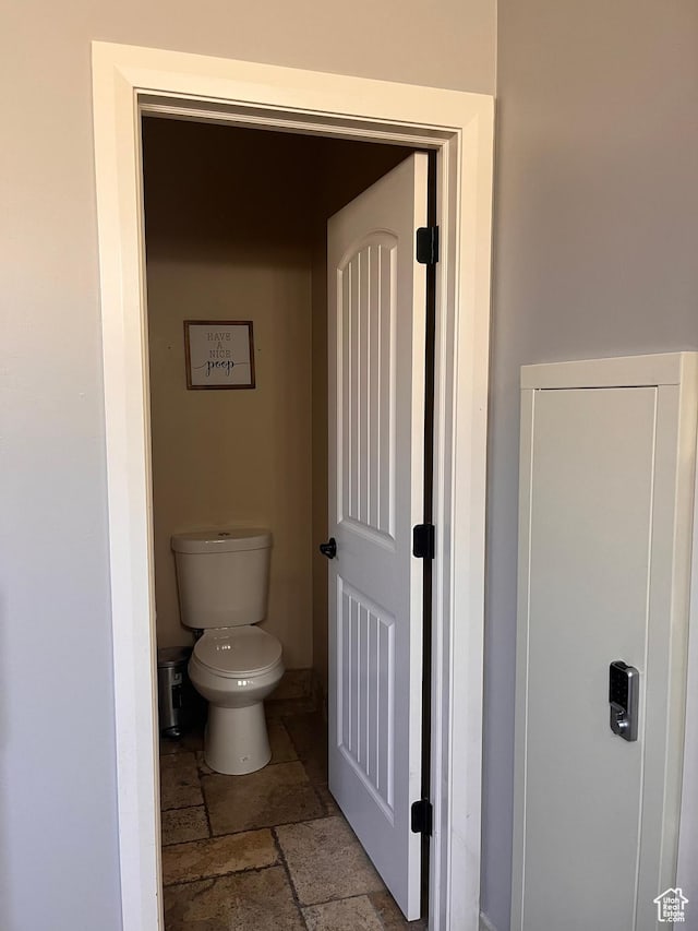 650 N Red Stone Rd Unit 22, Washington, UT 84780 - bathroom with toilet and stone tile flooring