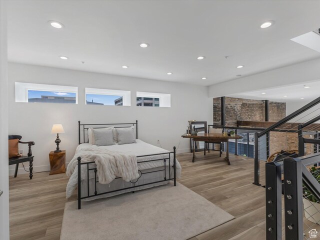 231 S Edison St E Unit 7, Salt Lake City, UT 84111 - bedroom with multiple windows, wood finished floors, and recessed lighting