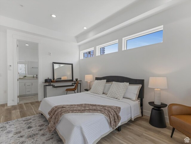 231 S Edison St E Unit 7, Salt Lake City, UT 84111 - bedroom with light wood-style floors, recessed lighting, and ensuite bath