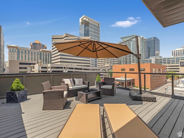 231 S Edison St E Unit 7, Salt Lake City, UT 84111 - wooden deck featuring a city view and an outdoor living space