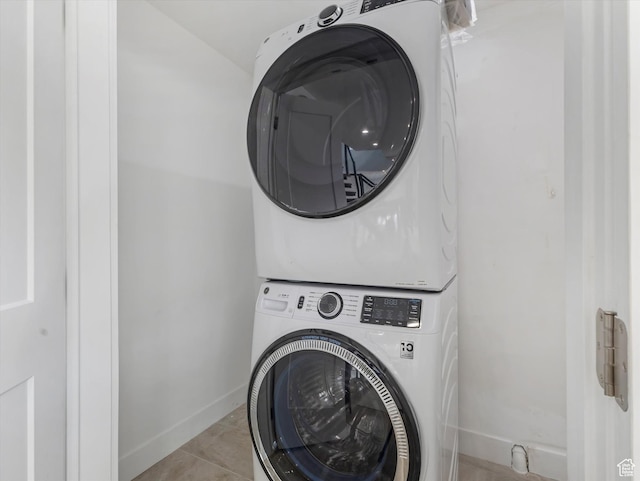 231 S Edison St E Unit 7, Salt Lake City, UT 84111 - washroom featuring stacked washer / dryer and tile patterned flooring