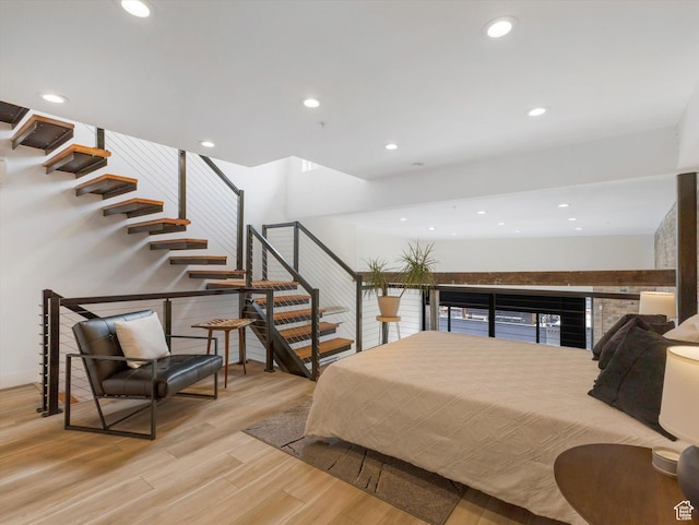 231 S Edison St E Unit 3, Salt Lake City, UT 84111 - bedroom featuring light wood-type flooring, recessed lighting, and a fireplace