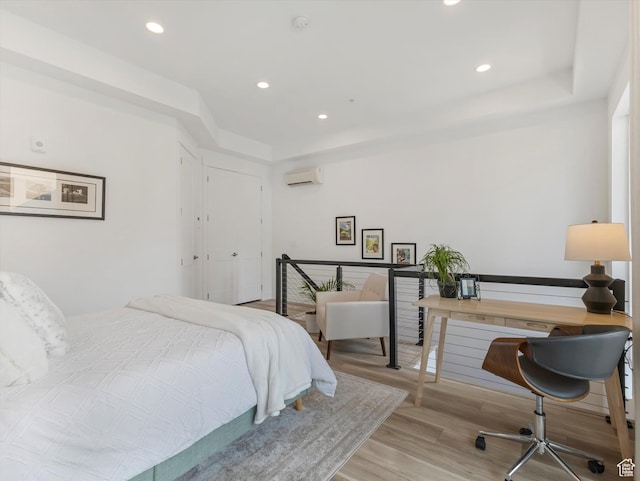 231 S Edison St E Unit 3, Salt Lake City, UT 84111 - bedroom featuring recessed lighting, light wood-type flooring, an office area, and an AC wall unit