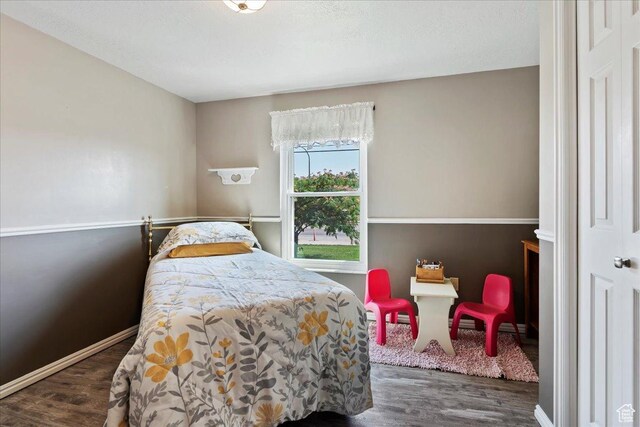 1154 W 1700 S, Syracuse, UT 84075 - bedroom featuring baseboards and wood finished floors