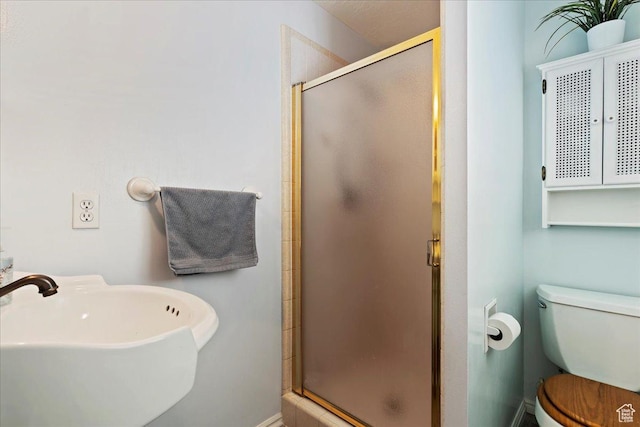 1154 W 1700 S, Syracuse, UT 84075 - full bathroom featuring a shower stall, baseboards, a sink, and toilet