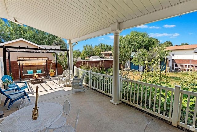 1154 W 1700 S, Syracuse, UT 84075 - view of patio / terrace featuring an outdoor living space with a fire pit