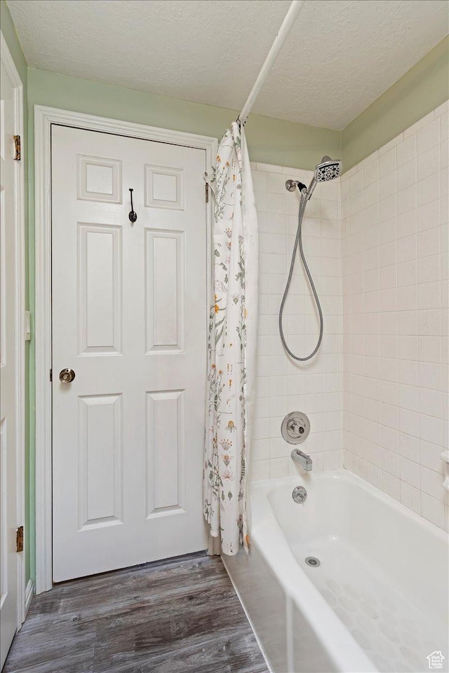 1154 W 1700 S, Syracuse, UT 84075 - full bathroom featuring shower / tub combo, a textured ceiling, and wood finished floors