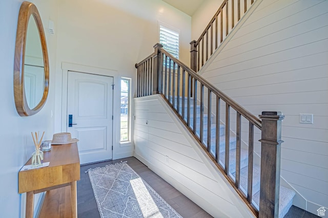 1120 N 520 W Unit 1, Midway, UT 84049 - foyer featuring wood walls, stairs, a high ceiling, and dark wood finished floors