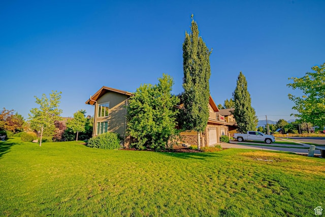 1120 N 520 W Unit 1, Midway, UT 84049 - view of yard with an attached garage and concrete driveway