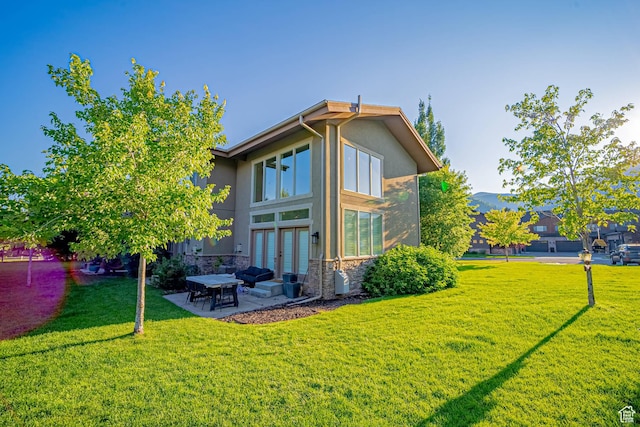 1120 N 520 W Unit 1, Midway, UT 84049 - exterior space featuring french doors, a patio, stucco siding, a lawn, and stone siding