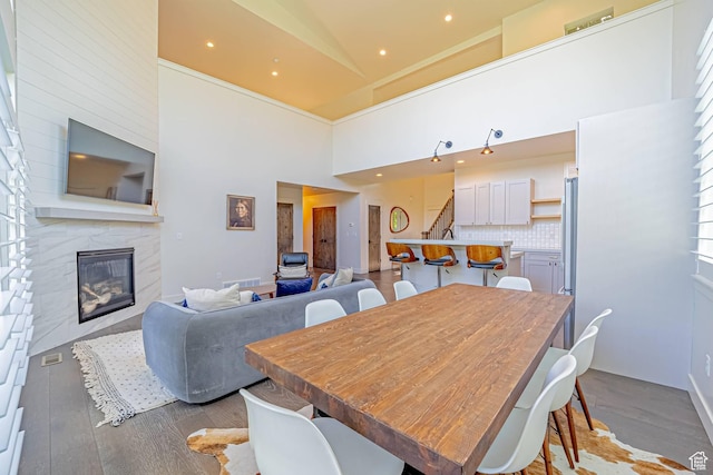 1120 N 520 W Unit 1, Midway, UT 84049 - dining area with recessed lighting, a premium fireplace, visible vents, stairway, and light wood-type flooring